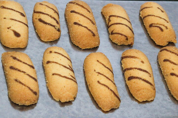 Kue lidah kucing or cat's tongue cookies. traditional cookies for eid holiday in indonesia. kue lebaran.