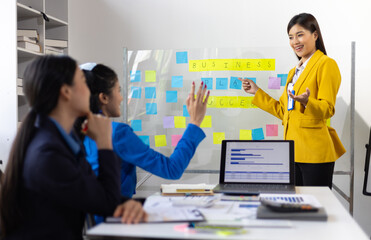 Business meeting, businesswoman is talking with colleagues and presenting planning a successful business project. Meet with colleagues to share ideas.