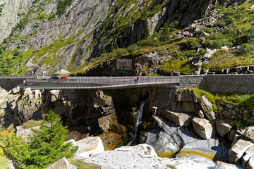Serpentine mountain pass road at famous Schöllenen Gorge at Swiss mountain village Göschenen on a...