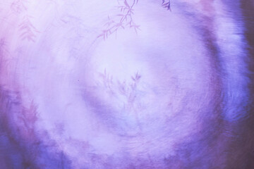 Abstract purple backdrop with subtle floral patterns
