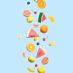 Summer fruit against a blue backdrop. The vibrant colors of the fruits stand out, evoking a sense of freshness and vitality. Dancing fruit party background concept.
