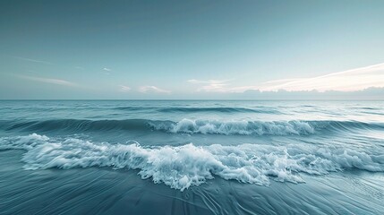 Obraz premium Ocean waves roll in, cresting and crashing on a sandy beach