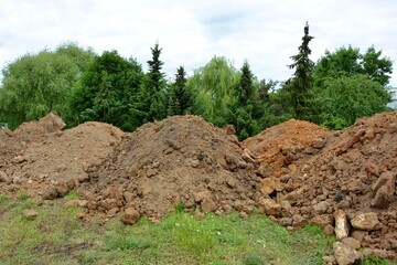 Heaps of soil on land