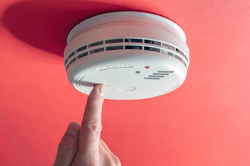 Home smoke and fire alarm detector checking, testing or replace battery