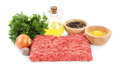 Raw ground meat, spices, egg, oil and parsley isolated on white