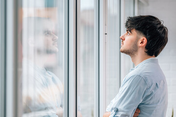 young man or student at the window