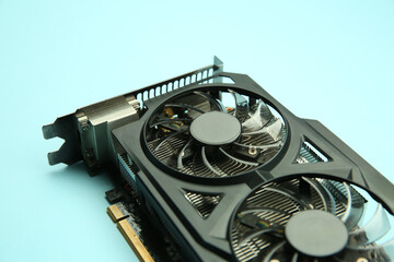 One graphics card on light blue background, closeup