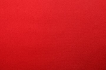 Texture of red silk fabric as background, top view