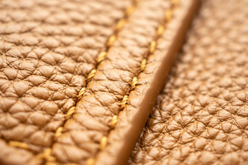 luxury brown leather bag texture background with stitching