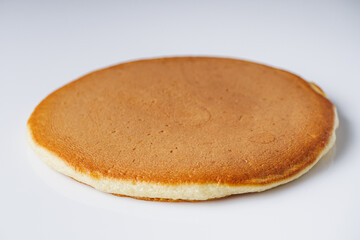fresh tasty pancakes on a white background