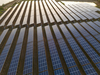 Solar cells farming beside with rivers and factories in industrial area. Green World concept with the ecosystem with technology recycling.