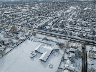 winter morning over city of Fort Collins in northern Colorado after snowstorm, aerial view