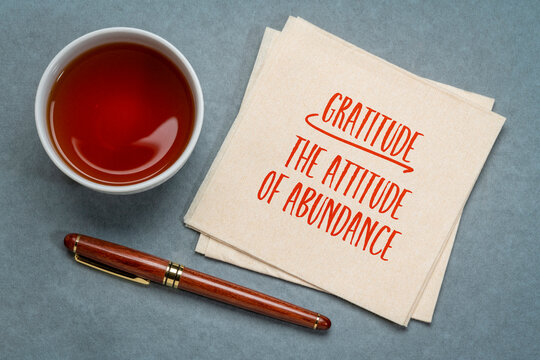 gratitude - the attitude of abundance inspiration note on a napkin, positivity concept