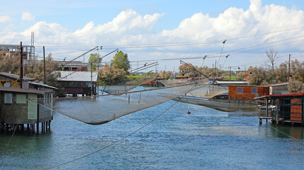 fishing hut called PADELLONI or BILANCIONI in Italian language over the Water of Canal