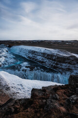 Snowy waterfall with ice