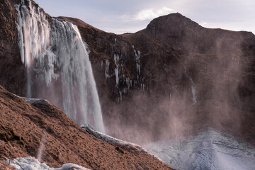 Snowy waterfall with ice