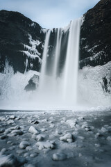 Snowy waterfall with ice