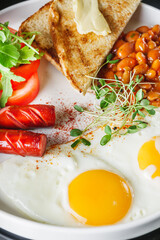 delicious traditional english breakfast on a white plate
