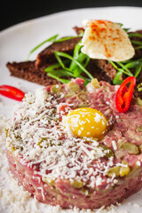 delicious fresh beef tartare on a white plate