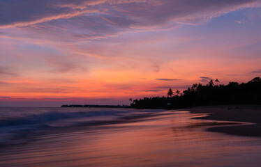 Stunning sunset sky with tropical beach landscape, Dramatic sunset background with ocean wave