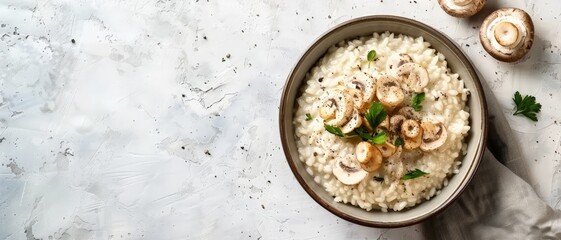 Top view of a creamy Italian risotto with mushrooms, using the rule of thirds, with ample copy space