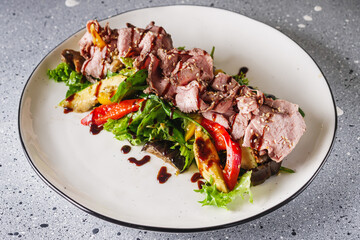 warm salad with roast beef, eggplant, zucchini, mushrooms and pesto sauce