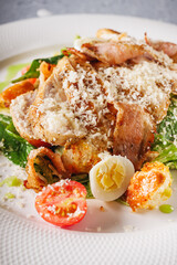 delicious fresh caesar salad with chicken cherry tomatoes and quail eggs