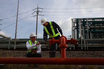 Two senior safety engineers inspecting the fire protection sprinkler  and valve piping system  of...