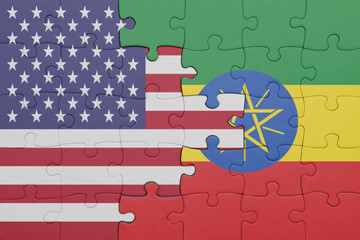 puzzle with the colourful national flag of ethiopia and flag of united states of america .
