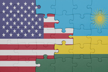 puzzle with the colourful national flag of rwanda and flag of united states of america .