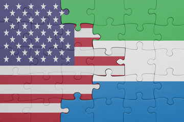 puzzle with the colourful national flag of sierra leone and flag of united states of america .