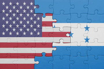 puzzle with the colourful national flag of honduras and flag of united states of america .