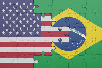 puzzle with the colourful national flag of brazil and flag of united states of america .