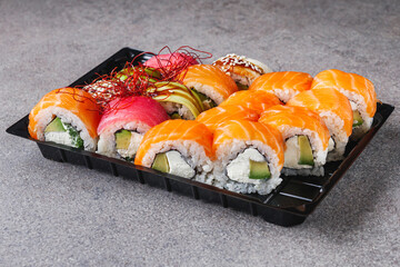 set of delicious fresh sushi roll with salmon avocado cucumber tuna eel Philadelphia cheese