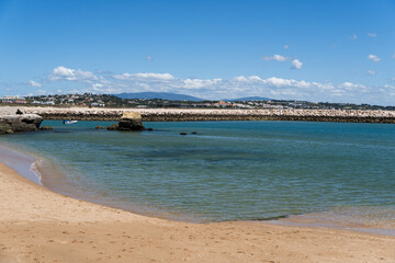 Praia da Batata beach of Ponta da Piedade in the Algarve, Portugal. Natural features, cliffs and limestone formations. Cais da Solaria. Solaria Pier
