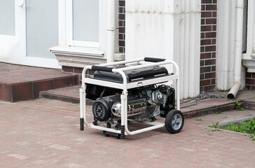 Power supply generator placed on street sidewalk. outdoor diesel power generator in Ukraine.