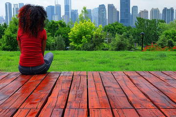 Woman sitting with back on wooden scaffold looking at city landscape with modern buildings.