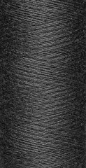 macro texture of a skein of black sewing thread