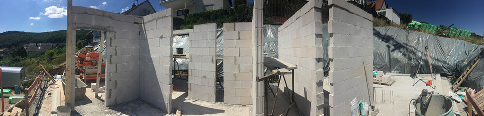 concrete walls to build a cellar at the construction site for a prefabricated family house.