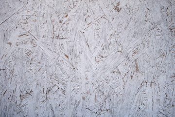 Chipboard OSB texture painted in white color.