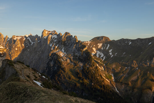 Sunset in the mountains, Saxer Gap mountain ridge swiss Alpstein alpine Appenzell Innerrhoden Switzerland, a steep ridge of the majestic Schaefler peak in the Alpstein mountain.