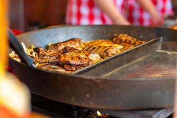 a pan on which fresh meat is seared