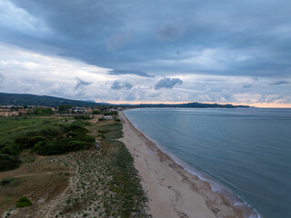 Stunning sunset sea view . Golden hour hues in semi wild unspoiled axaravi, Corfu, Greece, Europa.