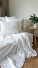 a Scandinavian-style interior mockup featuring a pristine white linen sofa adorned with plain cotton pillows, alongside a light wood end table.