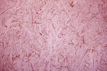 Chipboard OSB texture painted in red color.