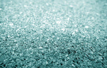 Cork advertising pin board texture close up with blur effect in cyan color.