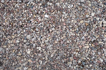 Pile of decorative pebblestones as background.
