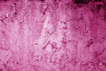 Peeling paint on grungy plaster wall. Pink color.