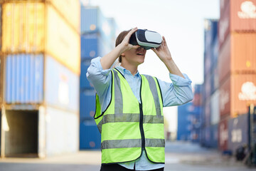 worker or engineer wearing virtual reality glasses(VR) in containers warehouse storage