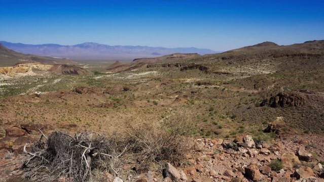 Pan right from the historic Route 66 across the Black Mountains near the historic mining town of Oatman in Mohave County, Arizona. 4K UHD video.